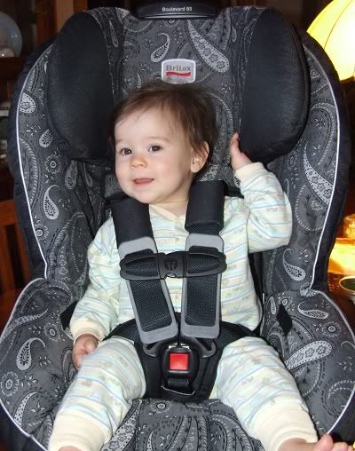 Clara in her carseat at 10 months old
